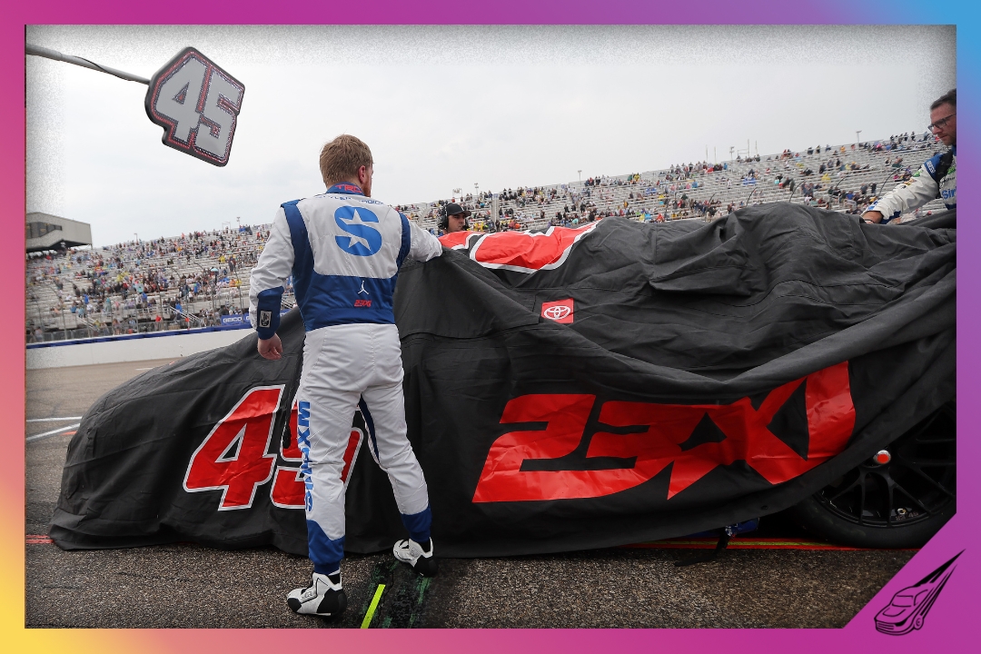 LOUDON, NEW HAMPSHIRE - JUNE 23: Tyler Reddick covers the #45 SiriusXM Toyota, on the grid during a weather delay in the NASCAR Cup Series USA Today 301 at New Hampshire Motor Speedway on June 23, 2024 in Loudon, New Hampshire. (Photo by Jonathan Bachman/Getty Images)