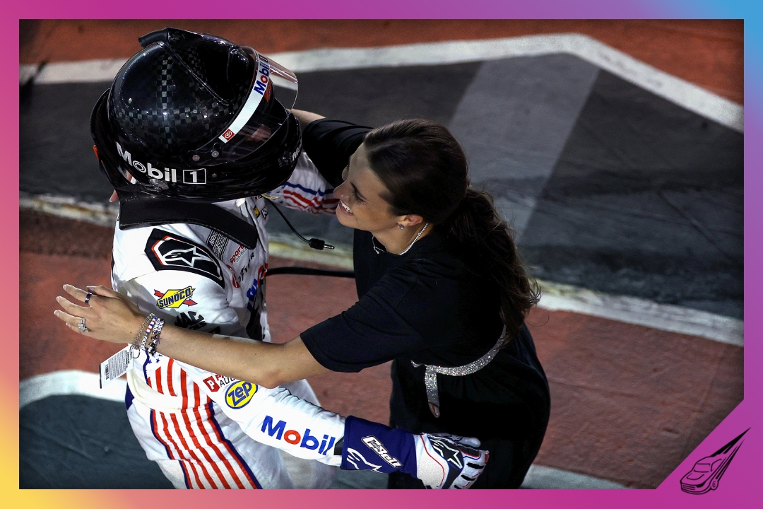 DARLINGTON, SOUTH CAROLINA - SEPTEMBER 06: Christopher Bell, driver of the #20 Mobil 1 Toyota, and wife, Morgan Bell embrace after winning the NASCAR Cup Series Cook Out Southern 500 at Darlington Raceway on September 06, 2026 in Darlington, South Carolina. (Photo by James Gilbert/Getty Images)