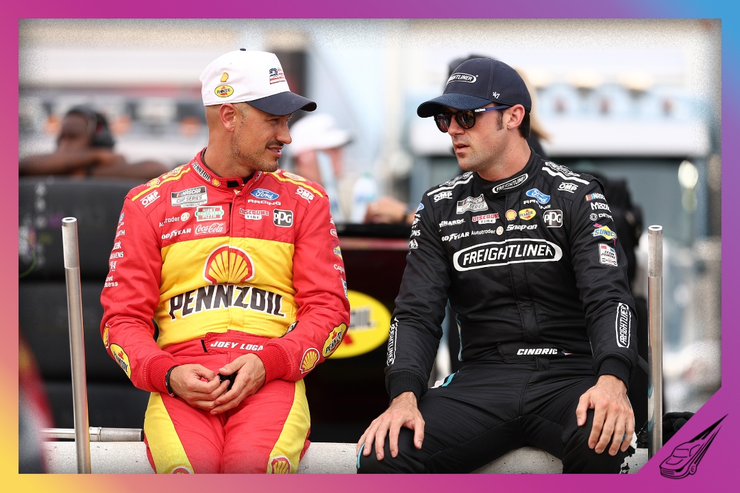 NORTH WILKESBORO, NORTH CAROLINA - JULY 18: Joey Logano, driver of the #22 Shell Pennzoil Ford, (L) and Austin Cindric, driver of the #2 Freightliner Ford, talk on the grid during practice for the NASCAR Cup Series Window World 450 at North Wilkesboro Speedway on July 18, 2026 in North Wilkesboro, North Carolina. (Photo by Meg Oliphant/Getty Images)