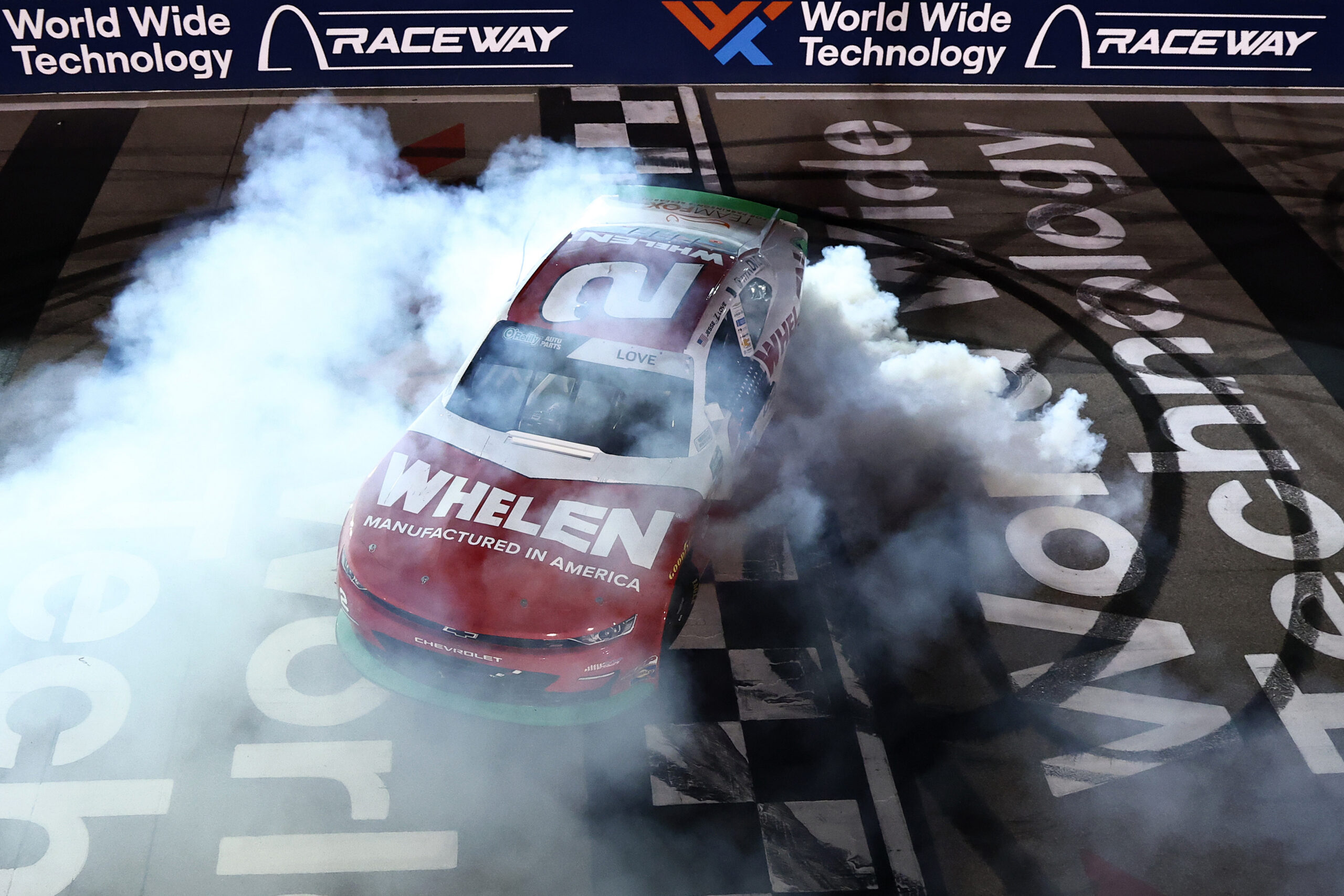 MADISON, ILLINOIS - SEPTEMBER 12: Jesse Love, driver of the #2 Whelen Chevrolet, celebrates with a burnout after winning the NASCAR O'Reilly Auto Parts Series Nu Way 225 Powered by Bobcat and Sauced by Blues Hog at WWT Raceway on September 12, 2026 in Madison, Illinois.